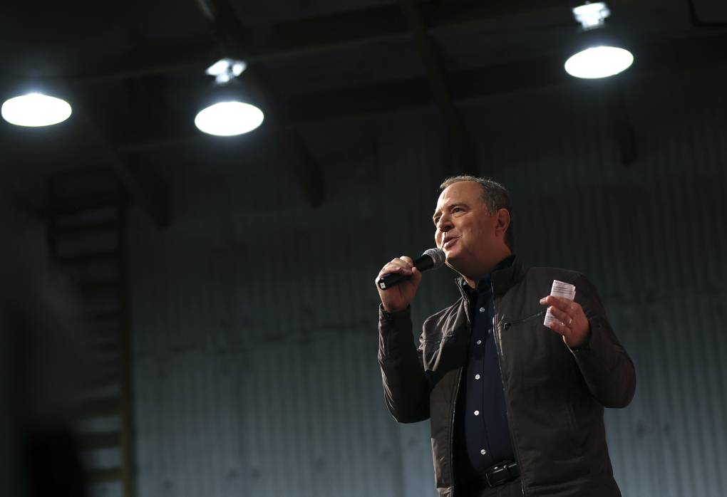 White man hands with mic to mouth