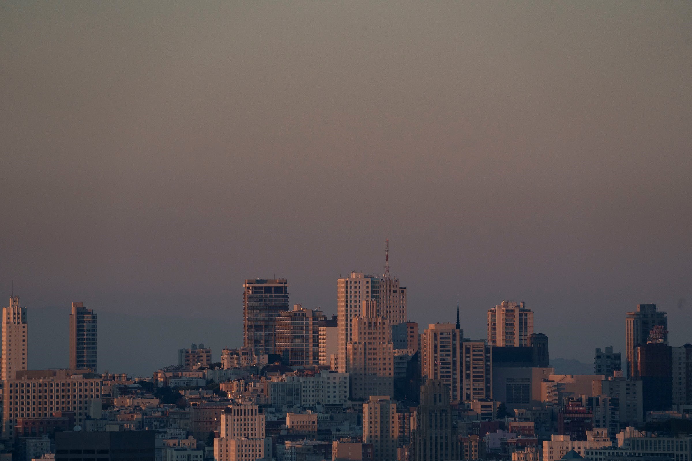A view of hazy skies for a city skyline.