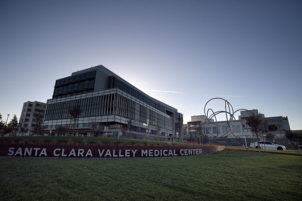 A large hospital building that says 'Santa Clara Valley Medical Center' in front.