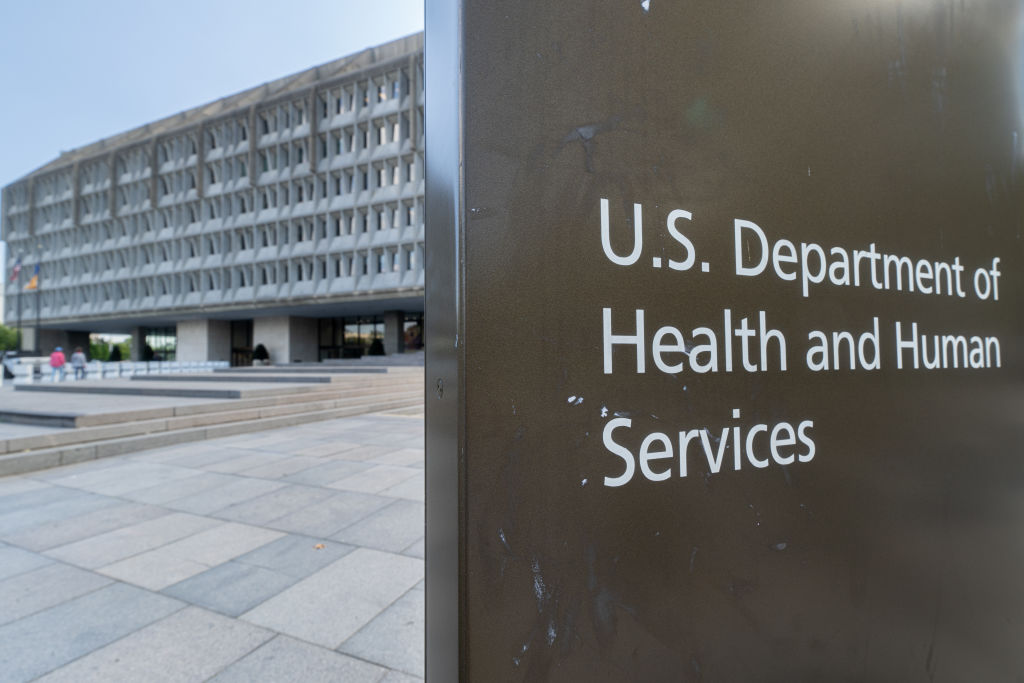 A sign in front of a large building that says 'U.S. Department of Health and Human Services.'