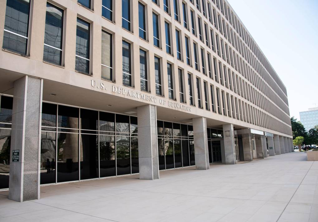 A large gray building with the words 'U.S. Department of Education' on the front.'