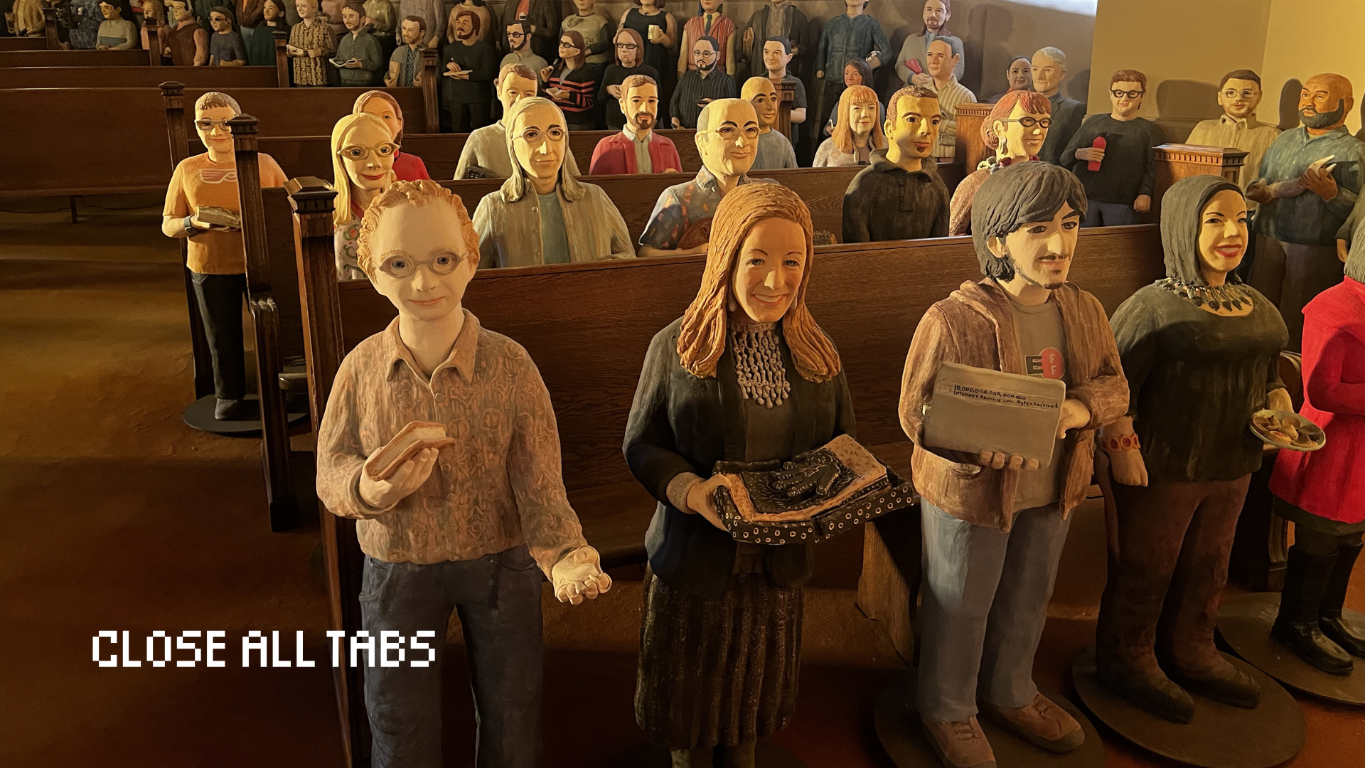 Dozens of small terracotta statues, each with distinct features and holding various items, stand arranged in rows along wooden pews in a church-like room. More statues line the curved back wall. Golden light illuminates the statues from the left. The words "Close All Tabs" appear in the bottom left corner.