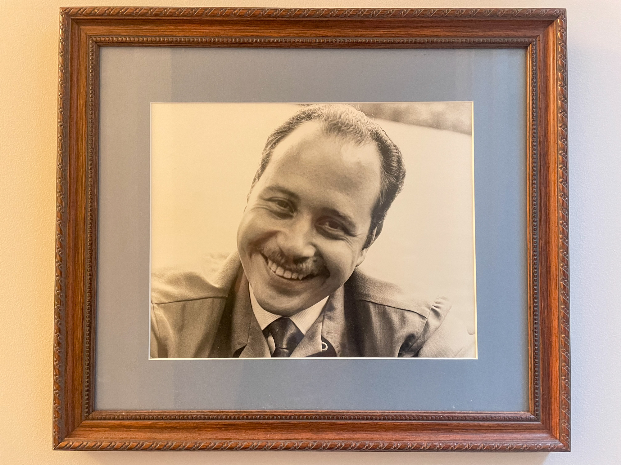 How a 1957 Vintage Radio Rekindled a Daughter’s Bond With Her Dad 3 A framed photograph of a young, smiling man.