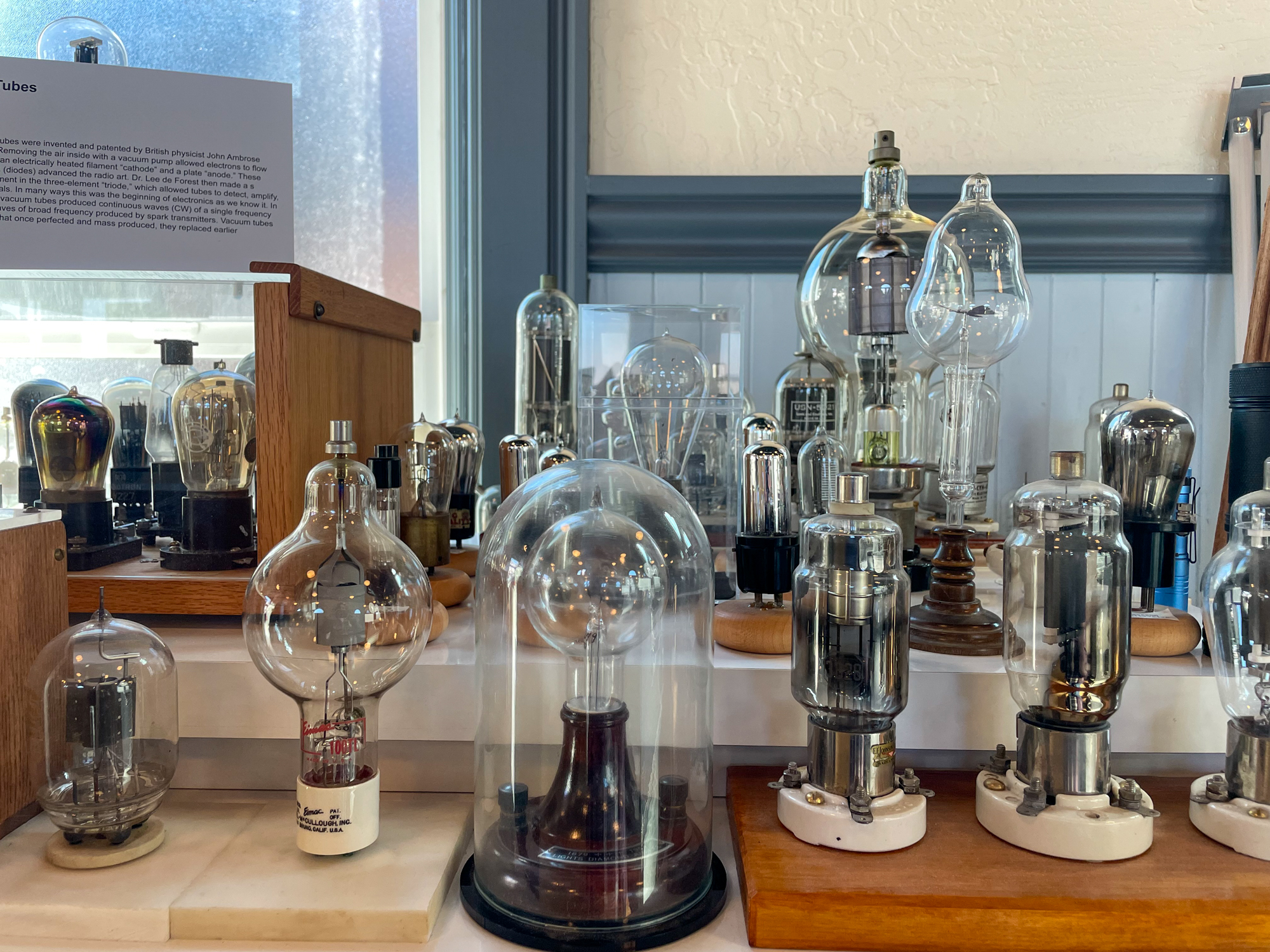 A museum display of vacuum tubes from the 20th century.