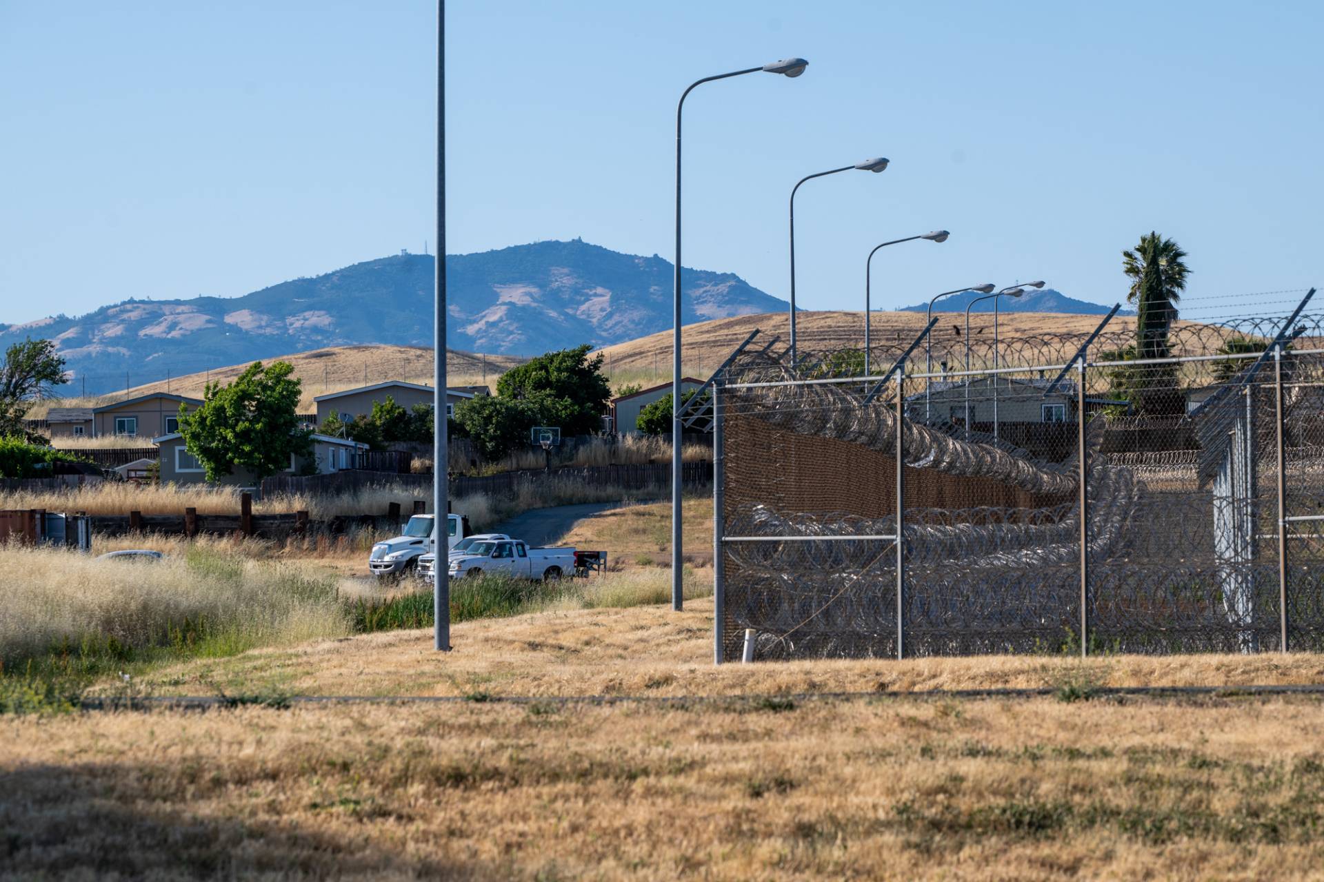 A neighborhood of mobile homes next to the now-closed Federal Correctional Institution, Dublin, on May 30, 2025. Many prison employees bought homes on the property, forming a small community of staff and their families beside the facility. Beth LaBerge/KQED