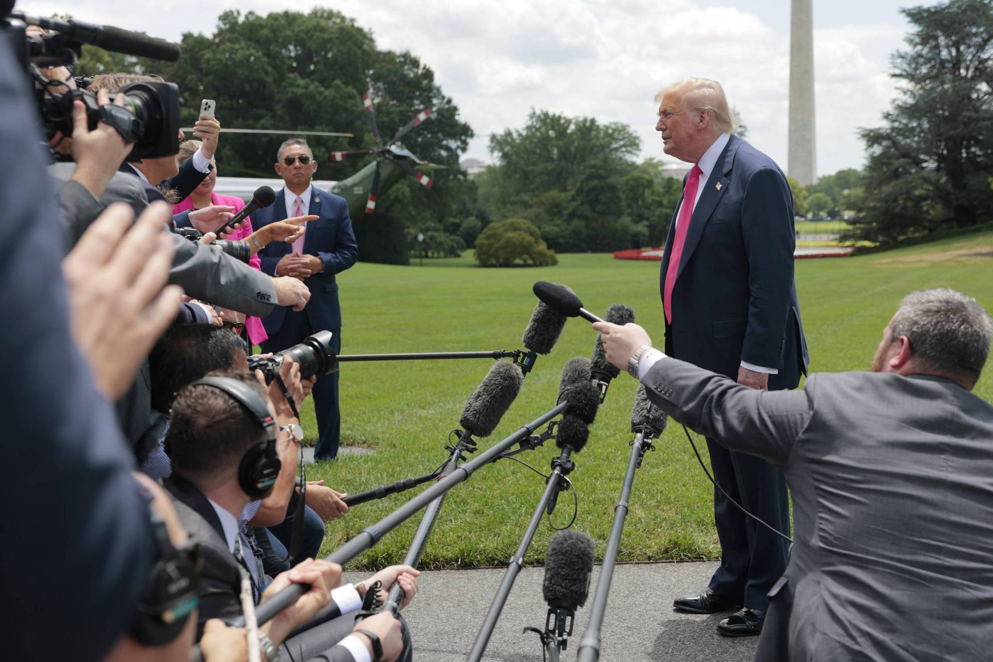 President Trump speaks to the media as he departs the White House on July 15 for Pittsburgh.