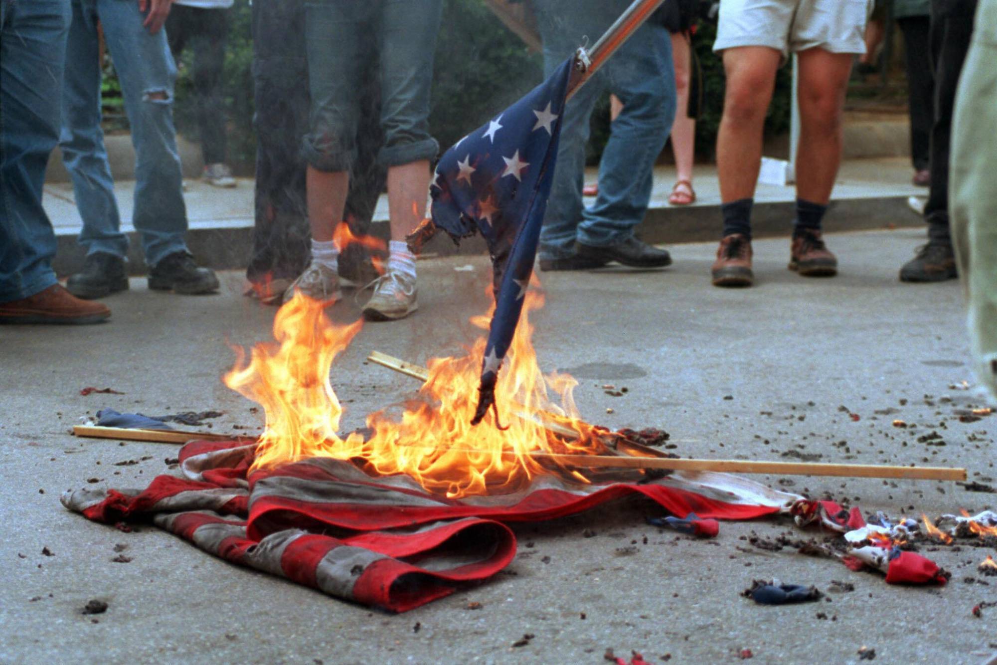 A 2002 file photo shows demonstrators burning U.S. flags during a protest in front of the World Bank headquarters in Washington, D.C.