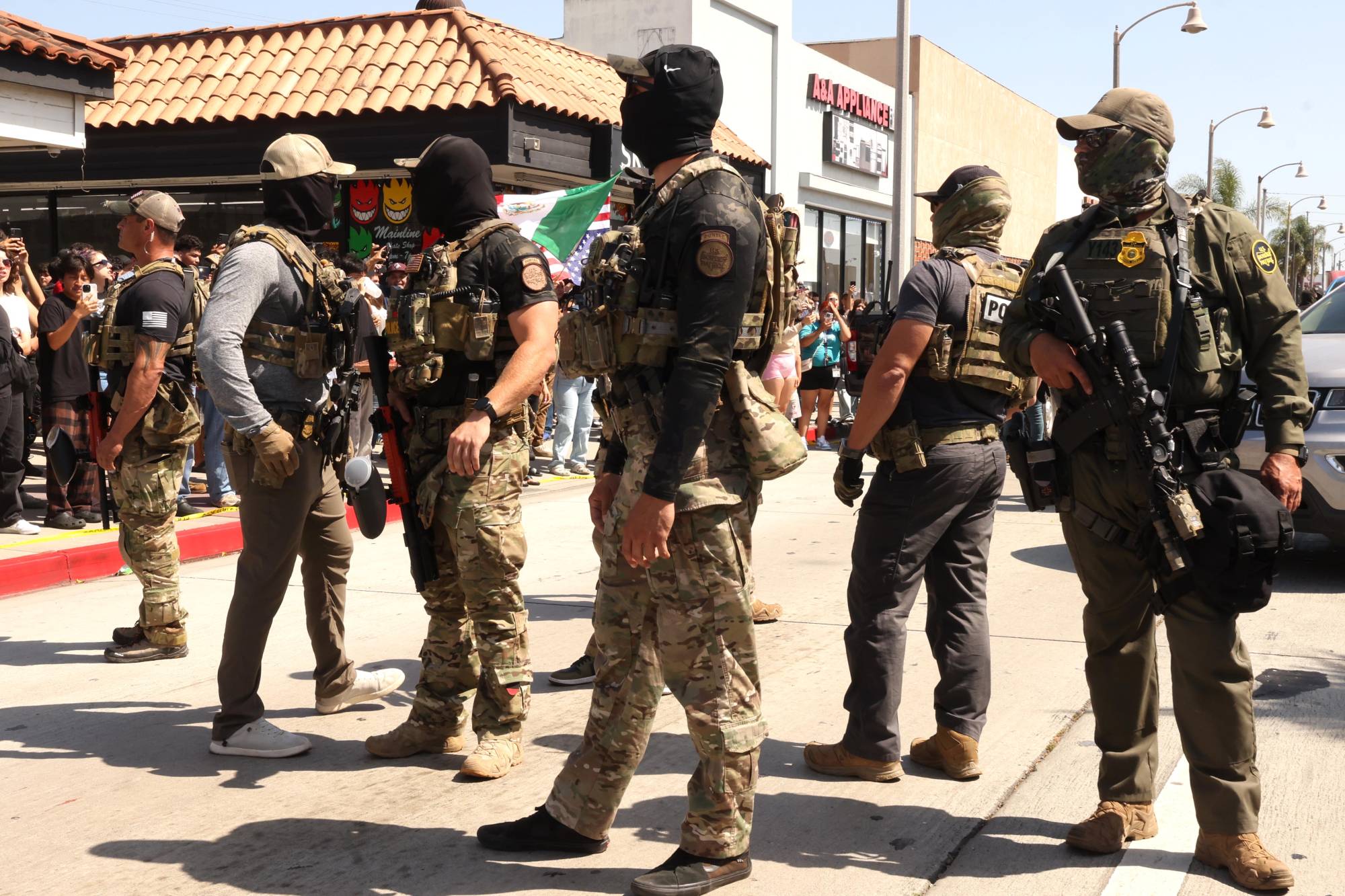 Masking Law Just Part Of Bigger Fight Over Immigration Enforcement | KQED
