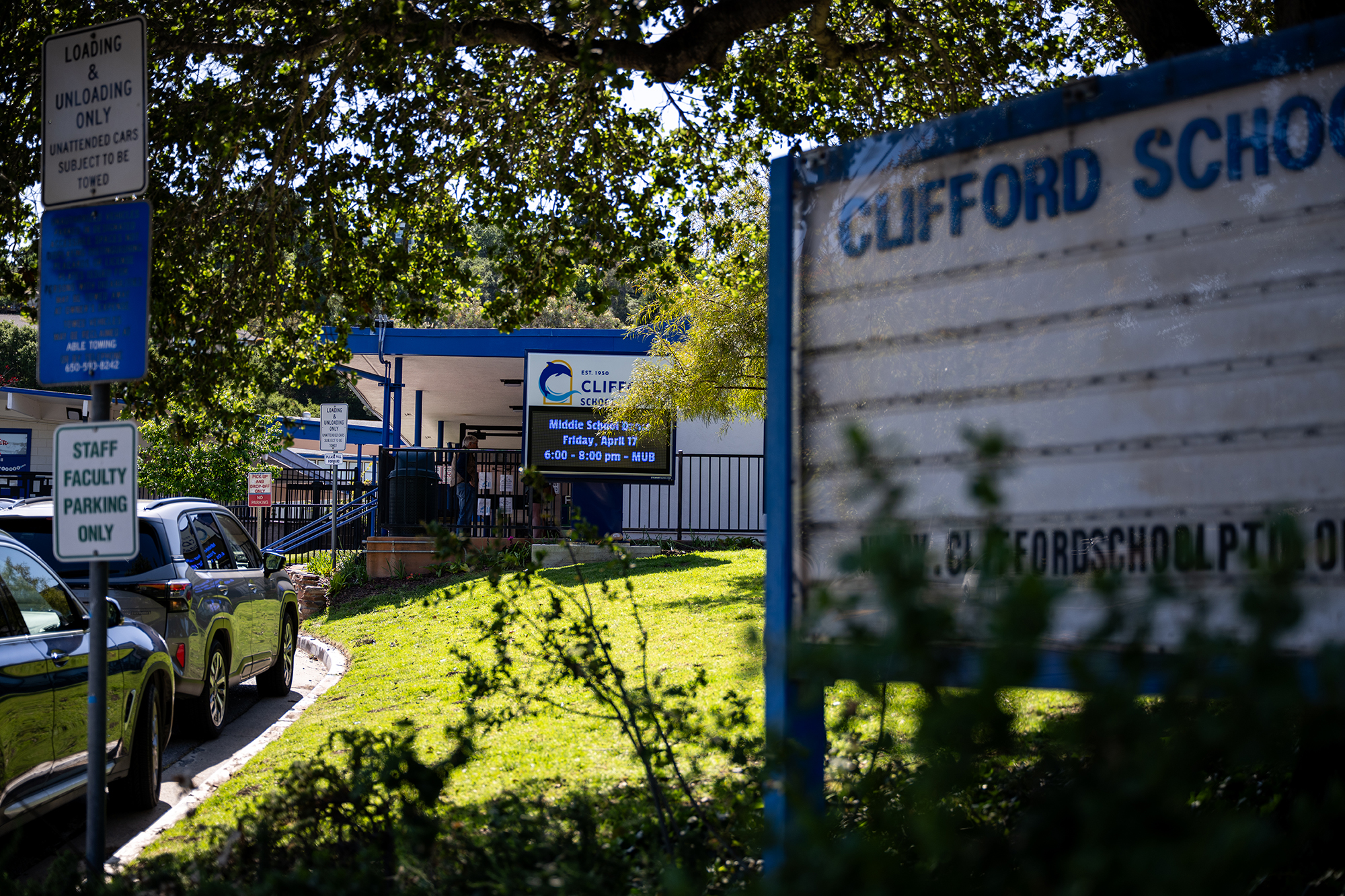 A school building with a sign in front of it that reads, &ldquo;Clifford School&rdquo;