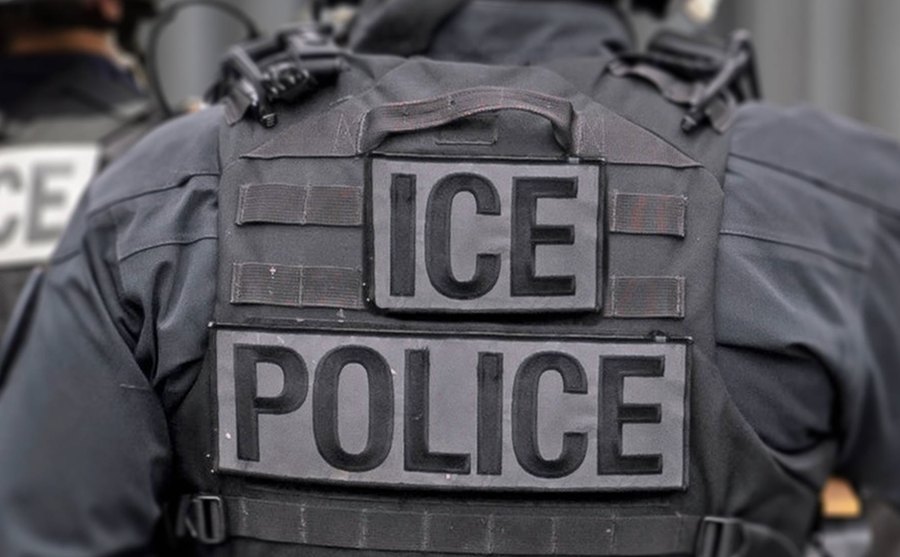 Immigration attorneys and advocates gathered outside an airport terminal.