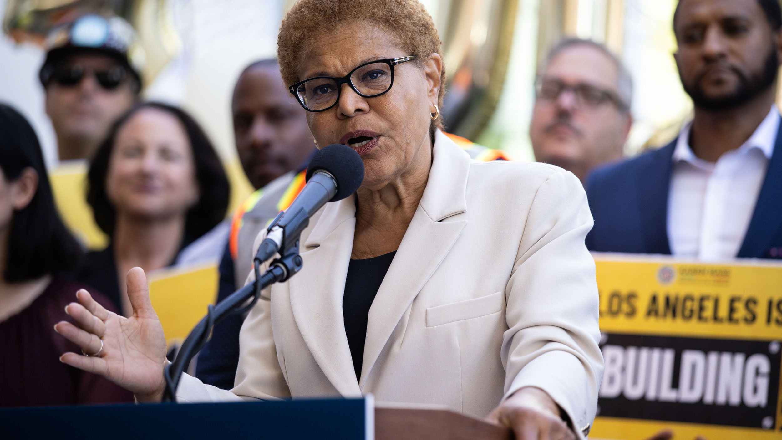 A woman speaks at a podium.