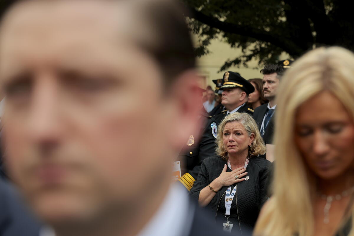 People look on during a ceremony commemorating the 25th anniversary of the September 11th terrorist attacks in the courtyard of the Pentagon on September 11, 2026 in Arlington, Va.