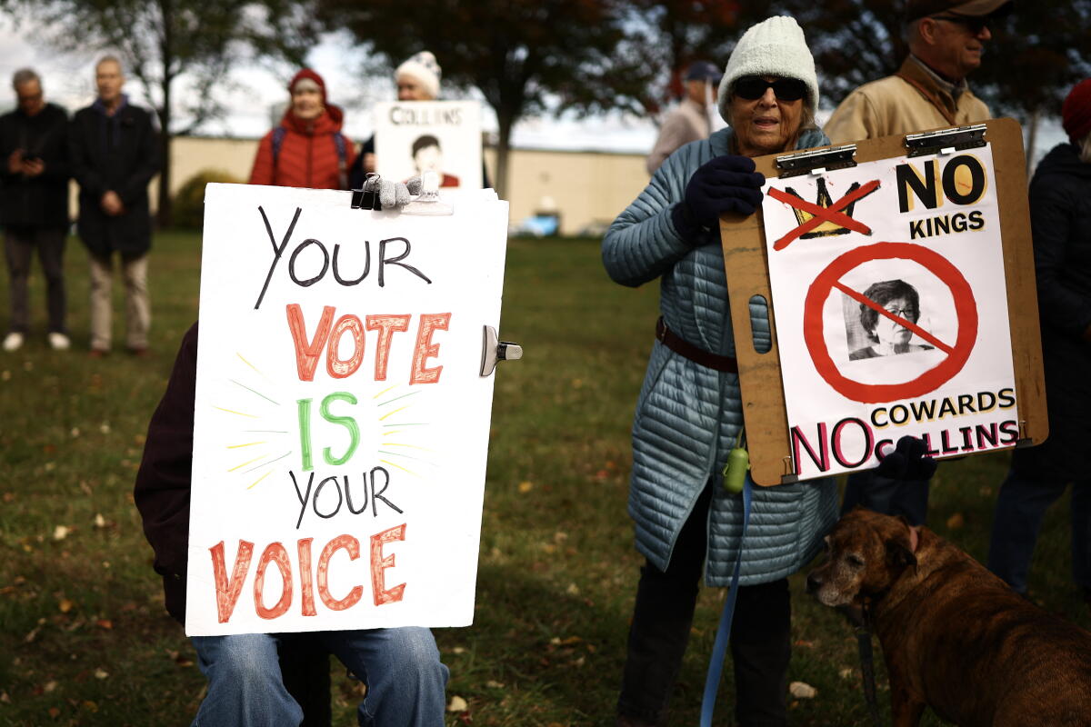 People gather during a 'No Kings: Vote Early' demonstration in Portland, Maine on Oct. 17.