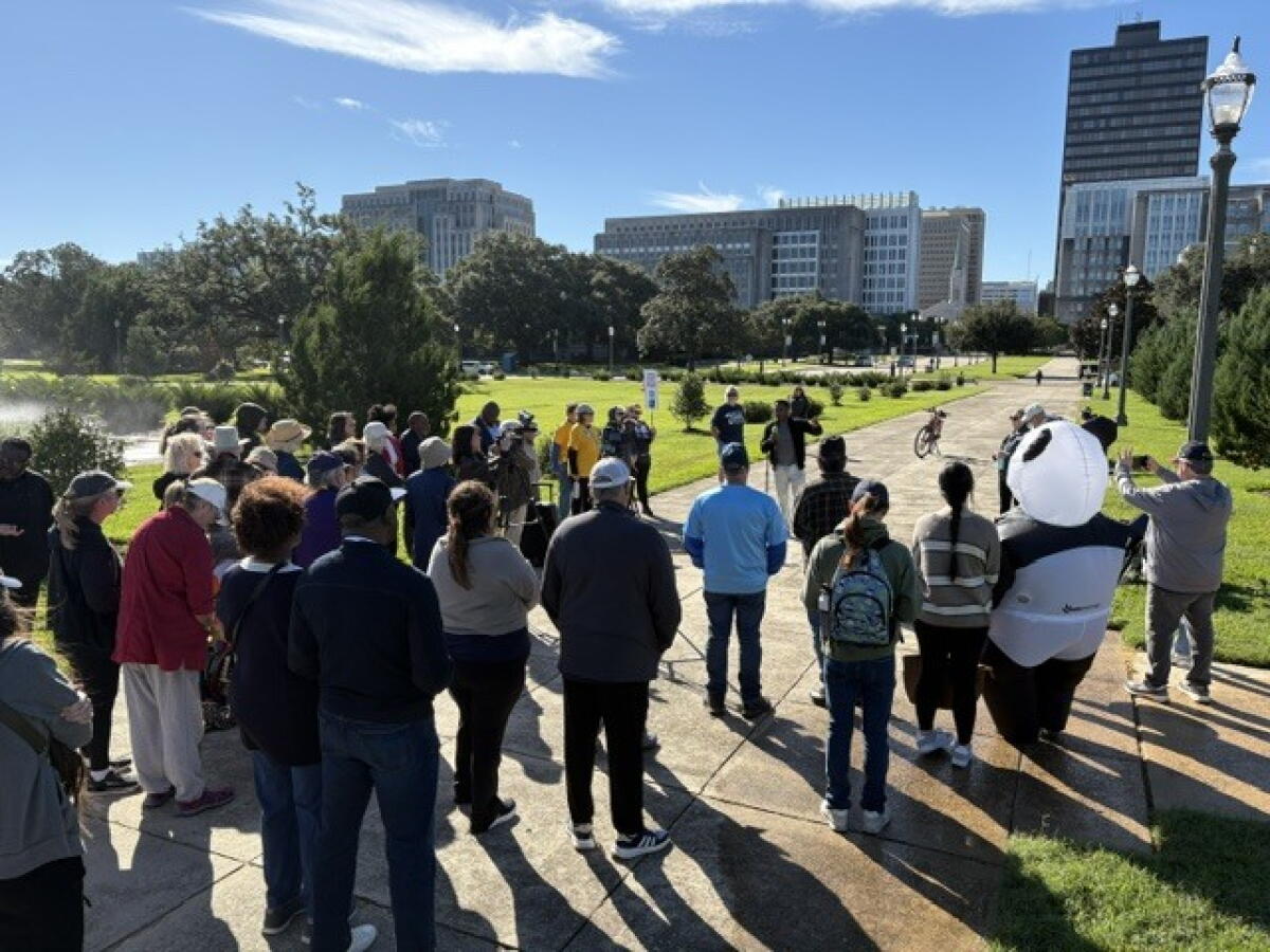 A No Kings rally at the State Capitol in Baton Rouge, La. Despite the colder weather, windy conditions and the Capitol grounds sprinklers at full blast, approximately 200 people attended the event.