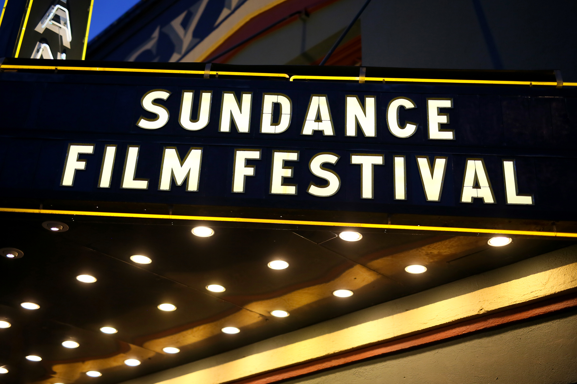A movie theater awning with a sign that says SUNDANCE FILM FESTIVAL.