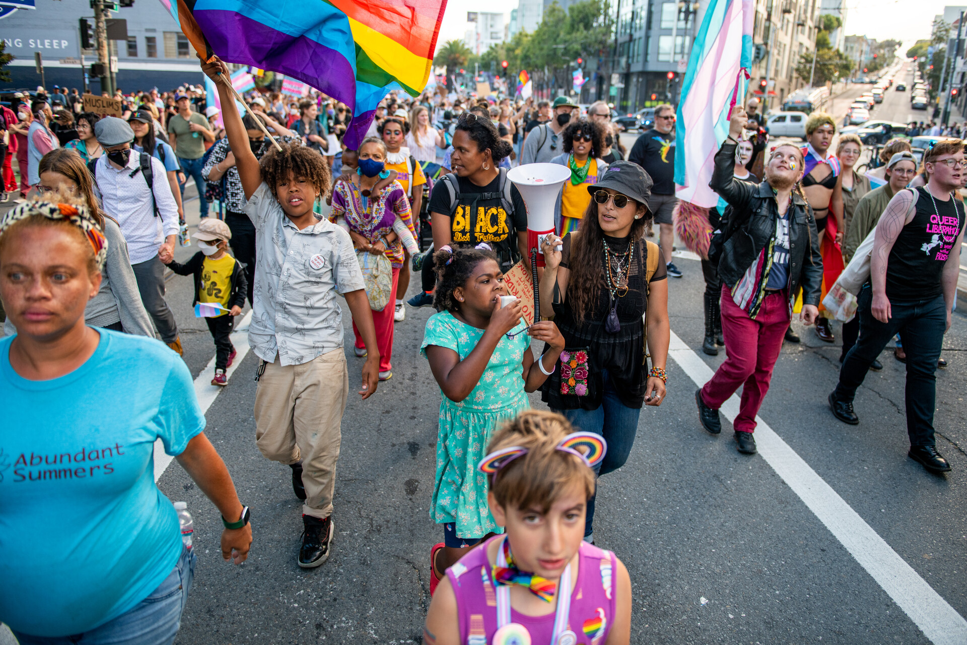 A young girl leads a chant at the Trans March.