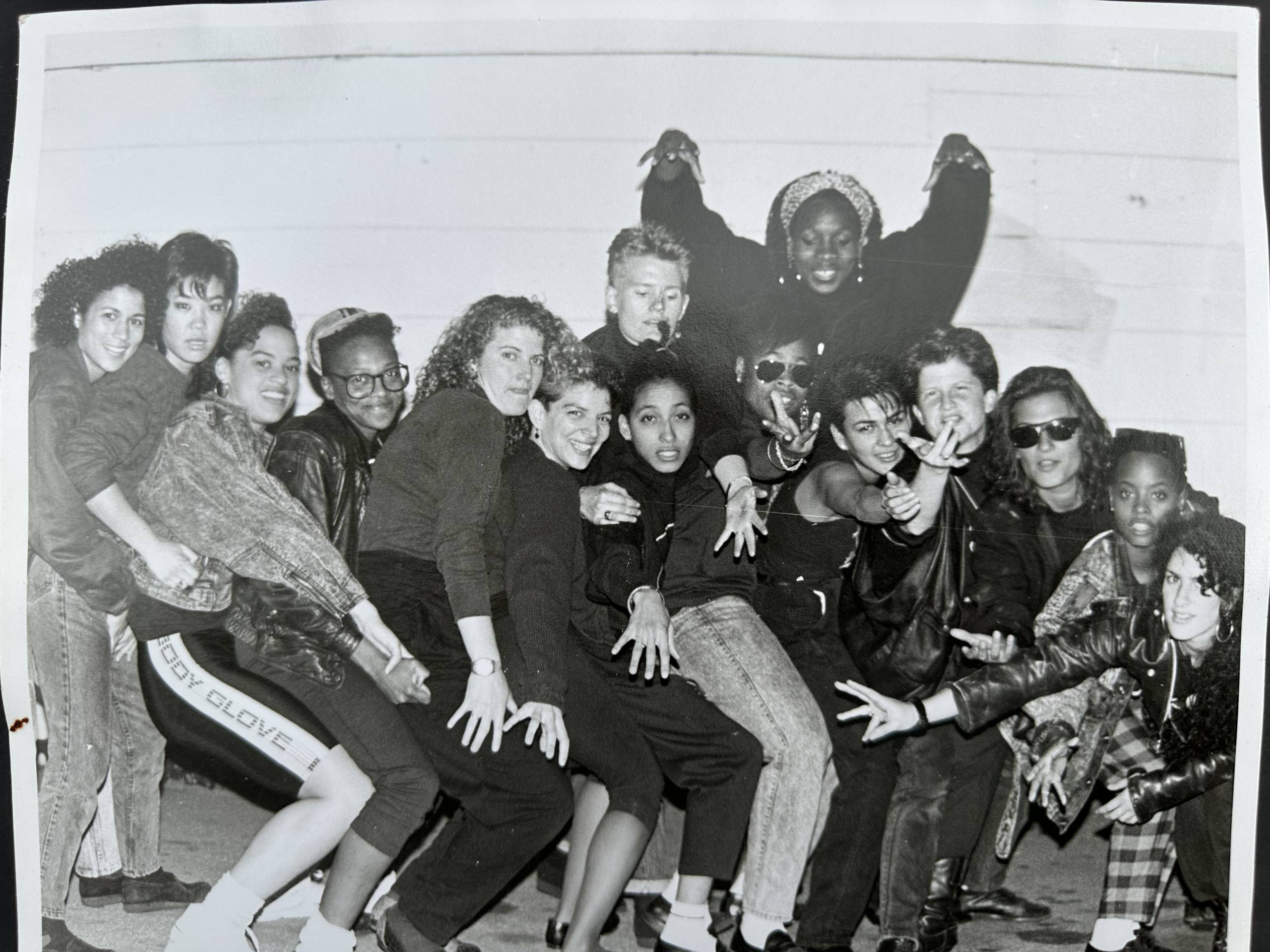 A black-and-white photo of a diverse group of women posing together. 