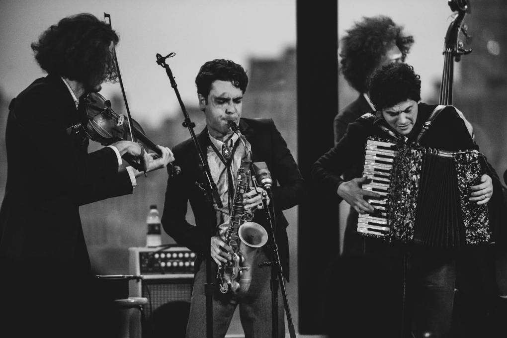 a black and white photo of a jazz quartet of young men
