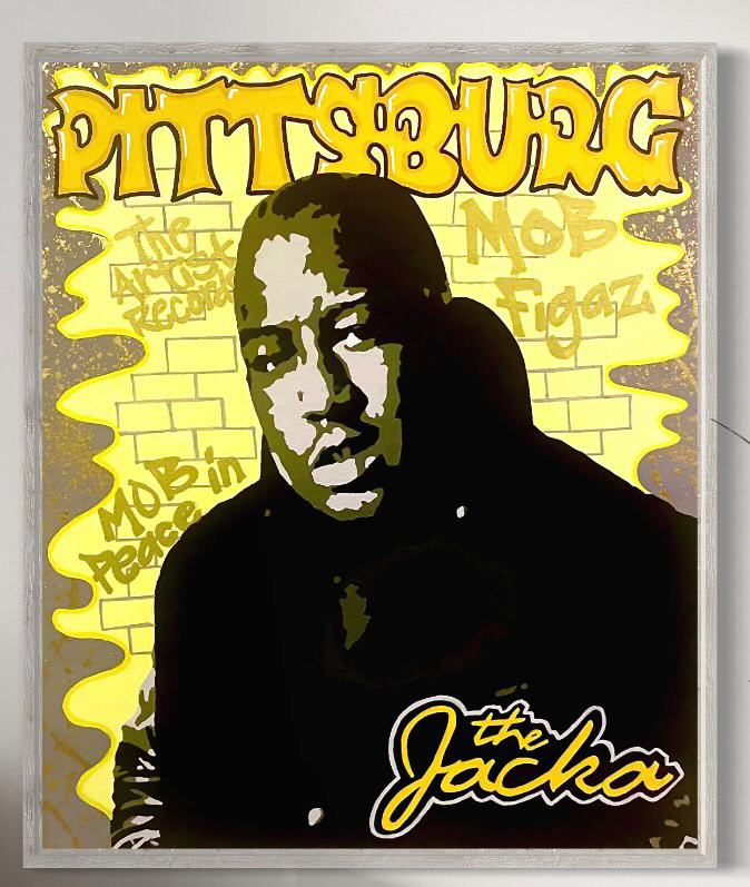 A stenciled portrait of The Jacka over a yellow brick background and graffiti letters.