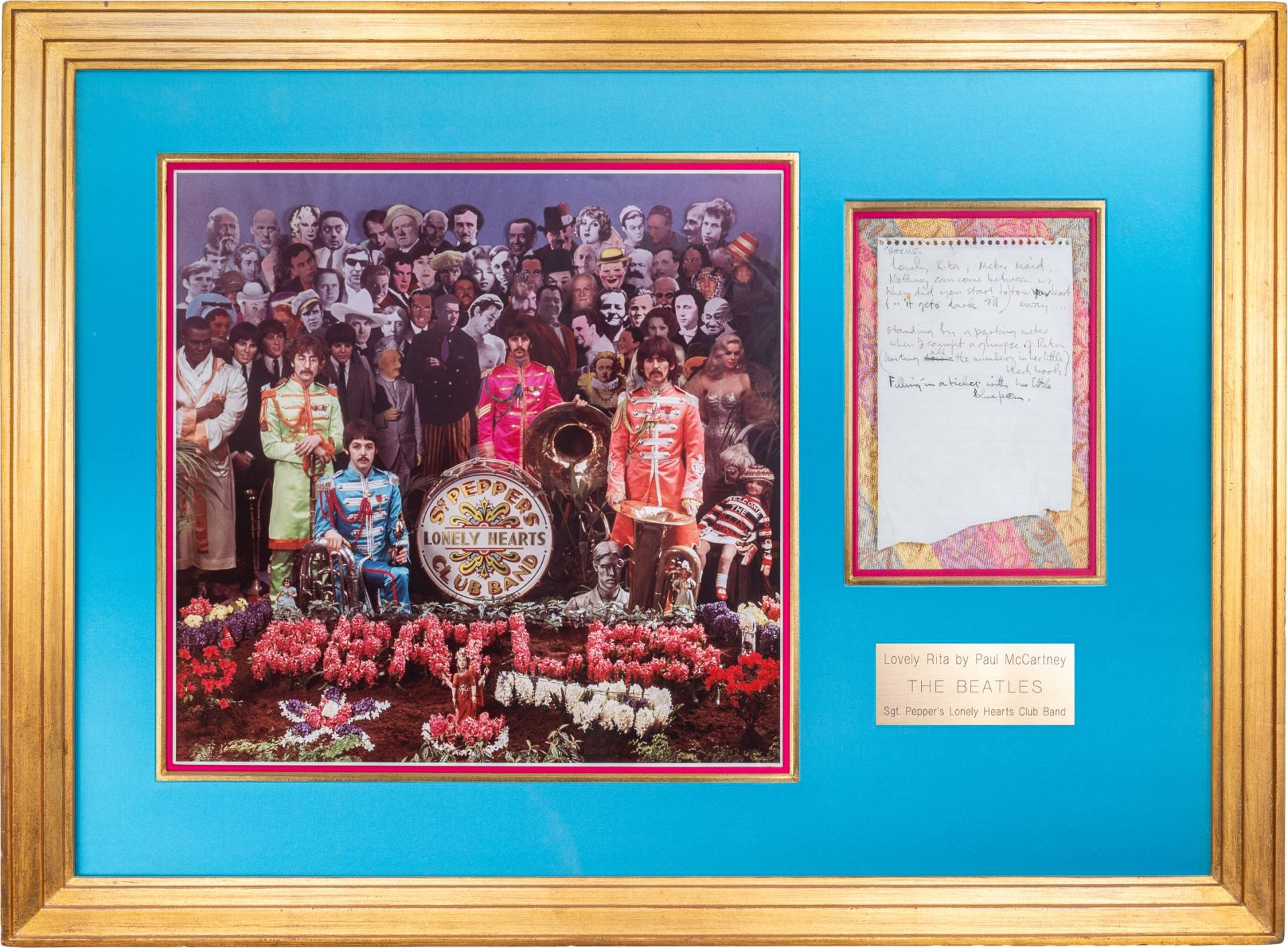 A frame containing a Beatles album cover and a piece of paper with handwriting on it.