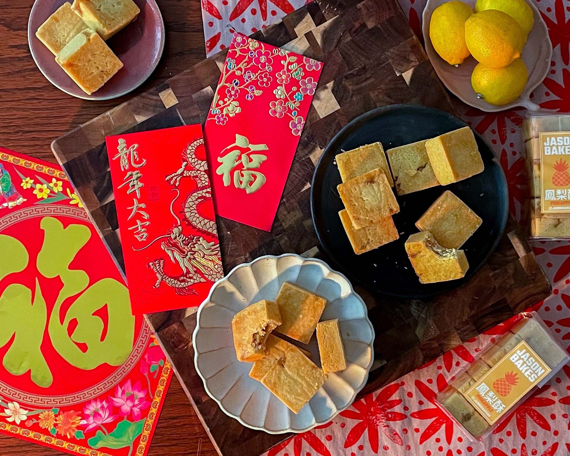a red table featuring Chinese cookies for Lunar New Year