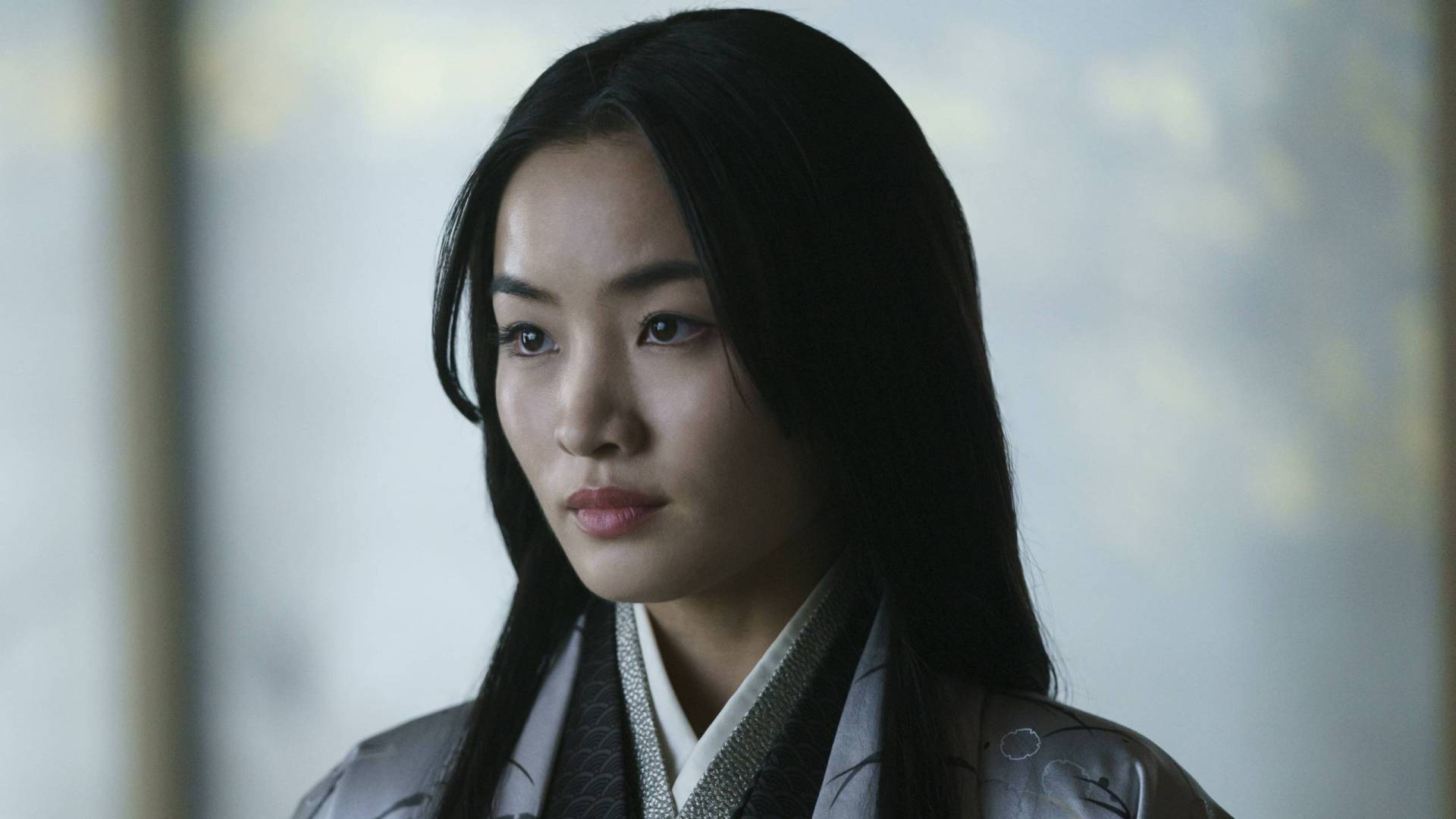 A Japanese woman in traditional clothing.