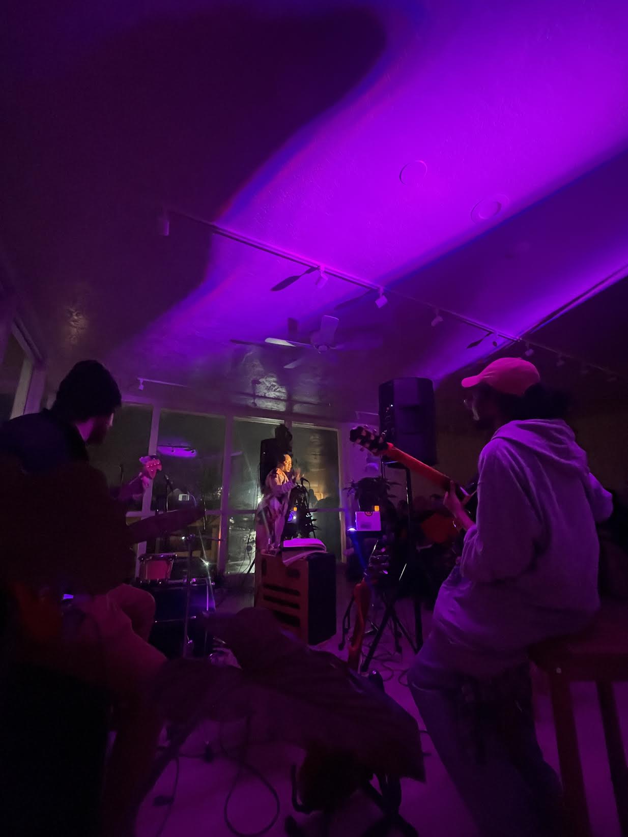 Purple mood lighting sets the tone as a live band plays during an Out The Way on J event.