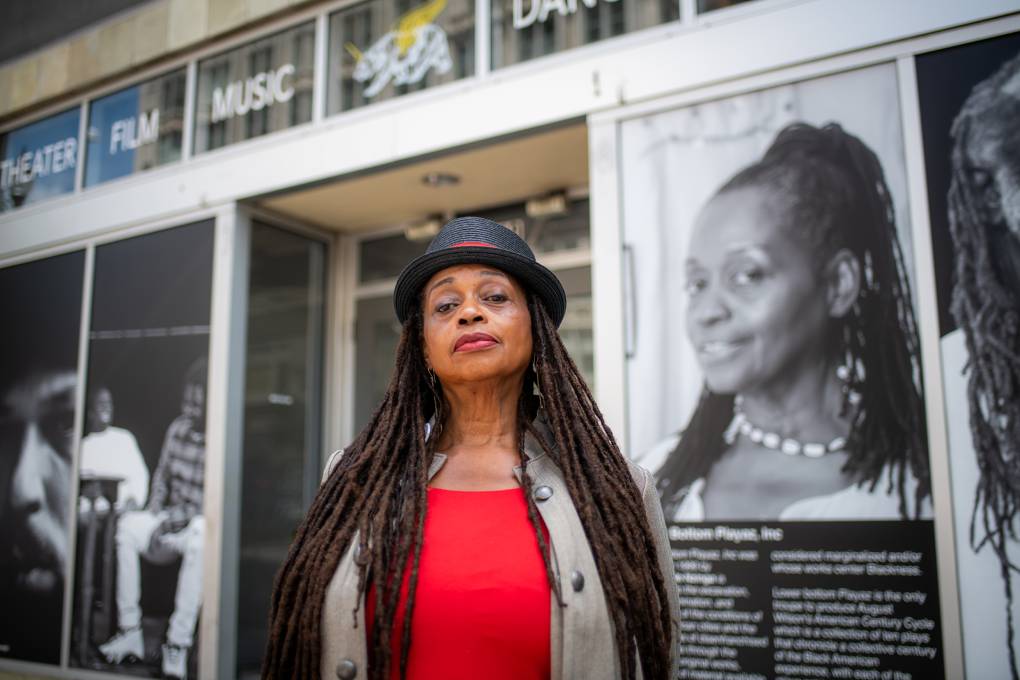 Ayodele Nzinga stands in front of a photo of herself, a part of the project Story Windows, at PianoFight theater in Oakland on July 19, 2021.