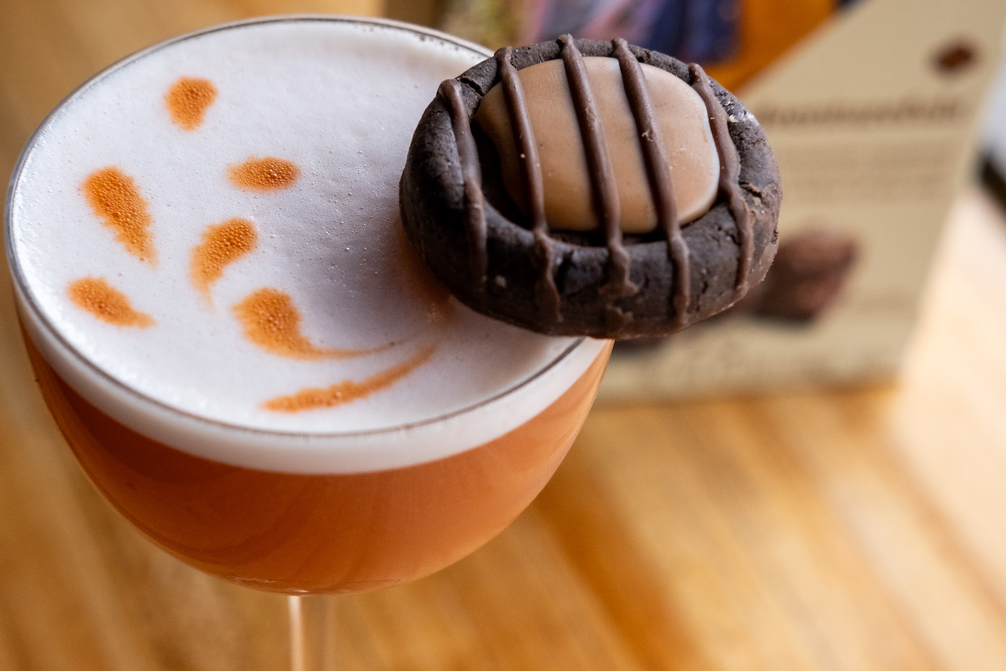 a cocktail made using ingredients from Girl Scout cookies is displayed at a bar