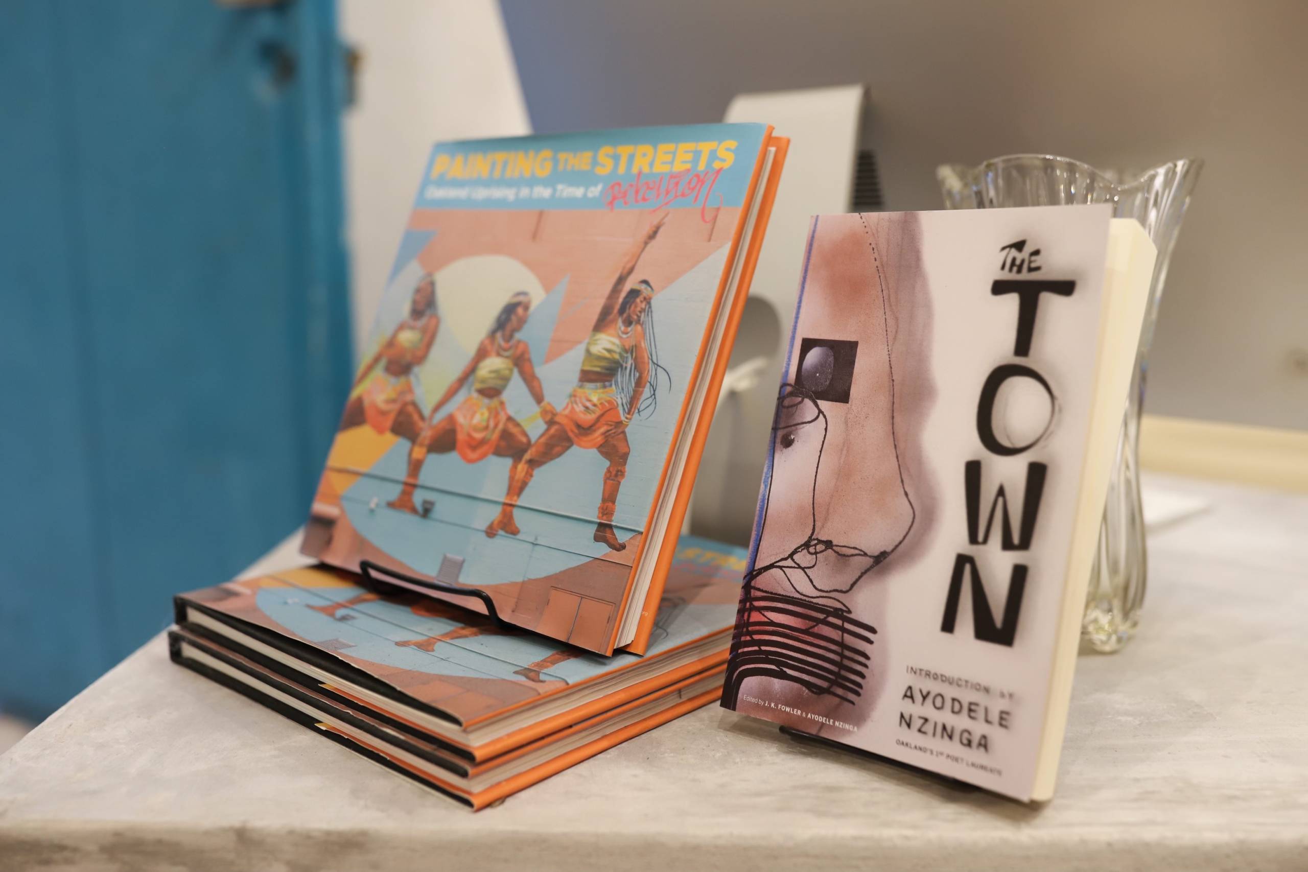 books about Oakland art are on display at a shop in Mexico