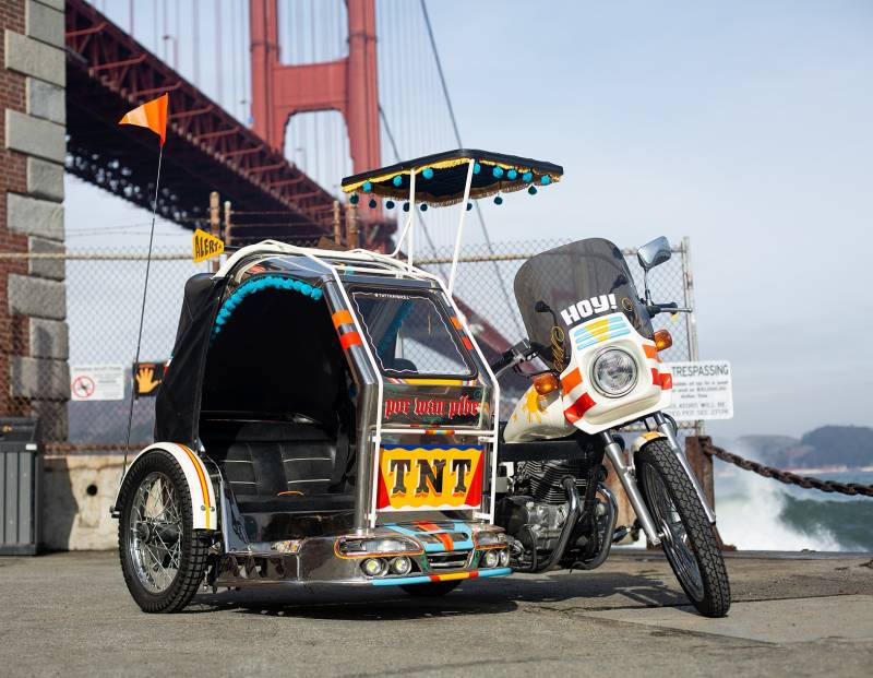 TNT Traysikel, a roaming sculpture that represents the Filipino-American community, parked in front of the Golden Gate Bridge. 