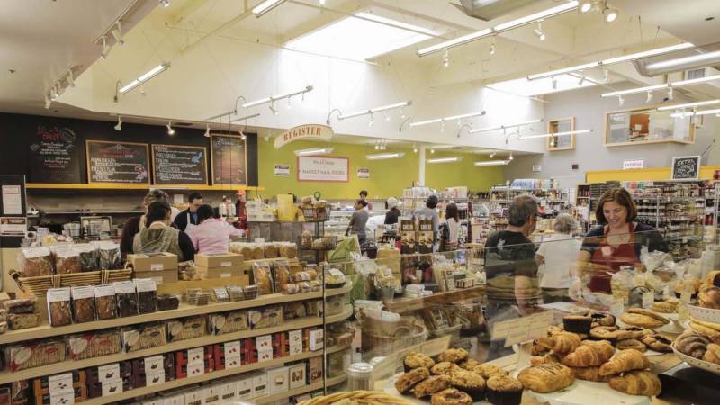 Bustling aisles inside a grocery store.