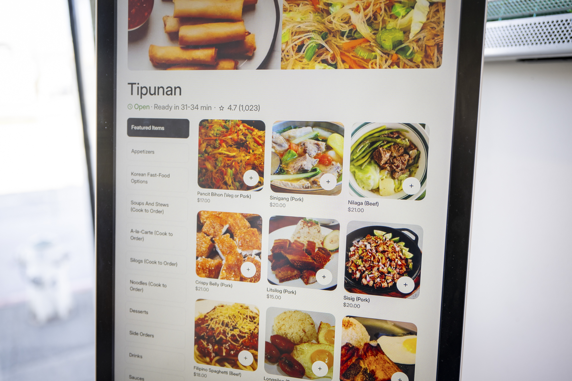 A touch screen menu for a Filipino restaurant.