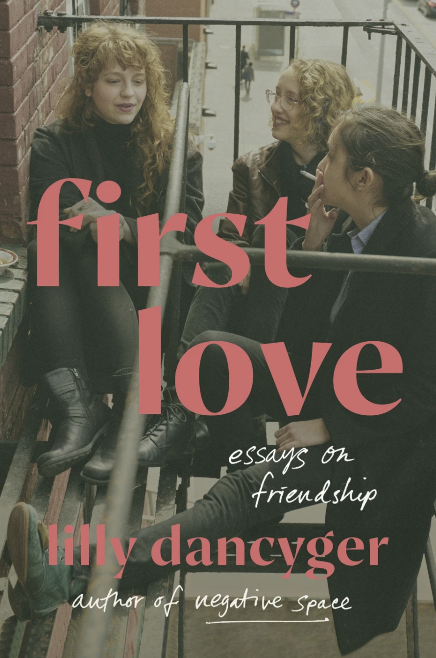 A book cover featuring a photo of three young women sat at the top of a fire escape outside a building. One of them is smoking a cigarette.