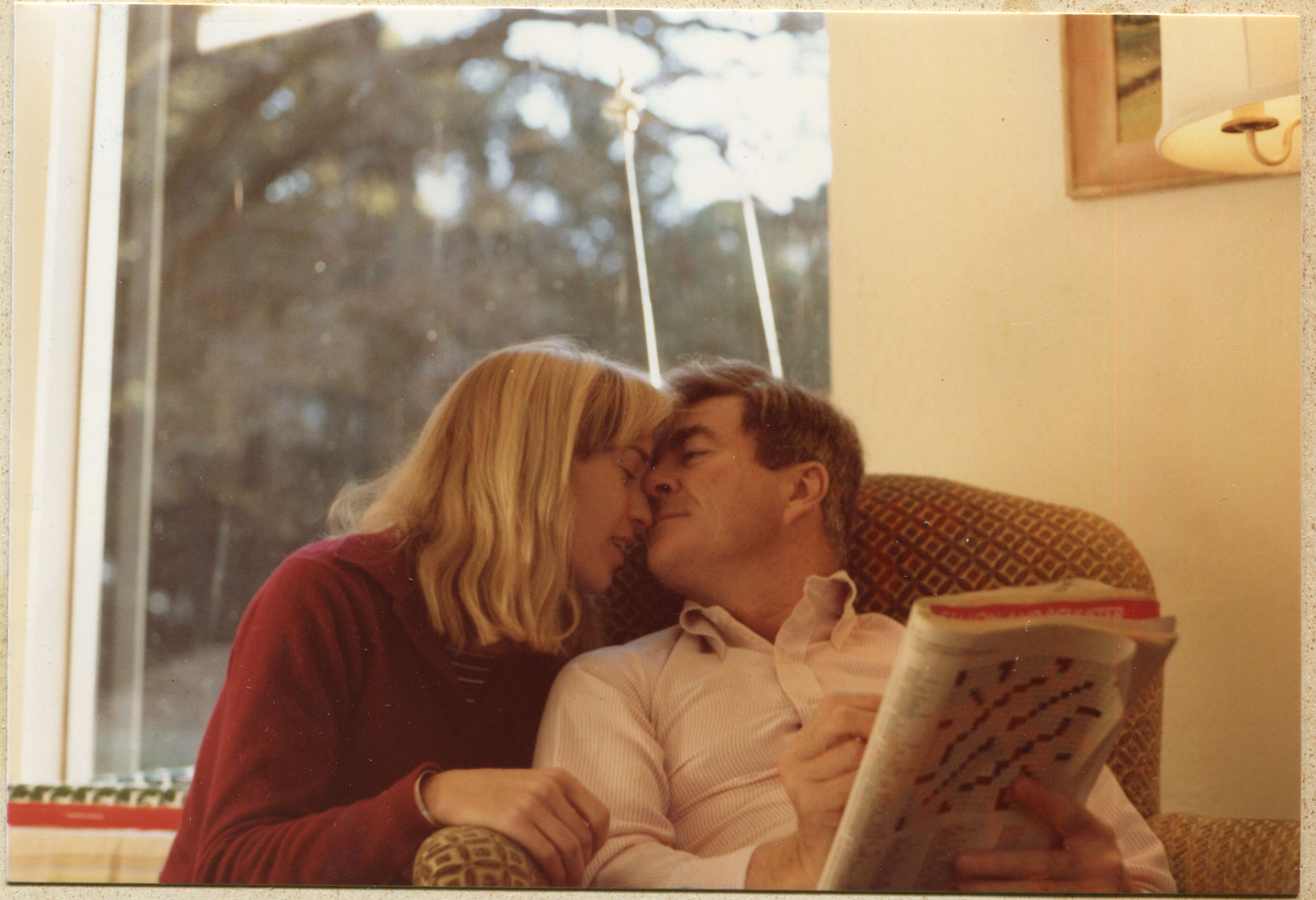Man and woman with heads together, eyes closed