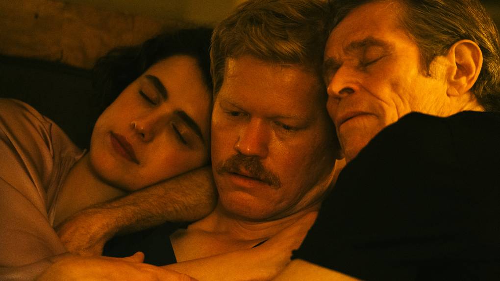 Three people with heads close in tightly cropped image