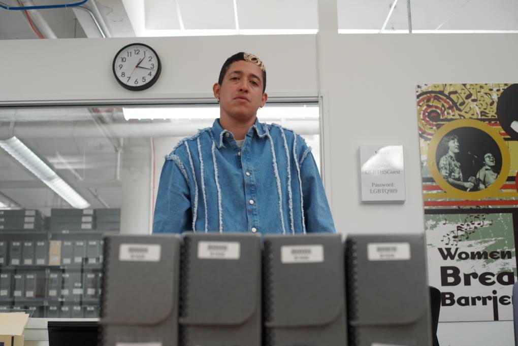 Artist and curator Marcel Pardo Ariza poses for a photo at the archives of San Francisco's GLBT Historical Society.