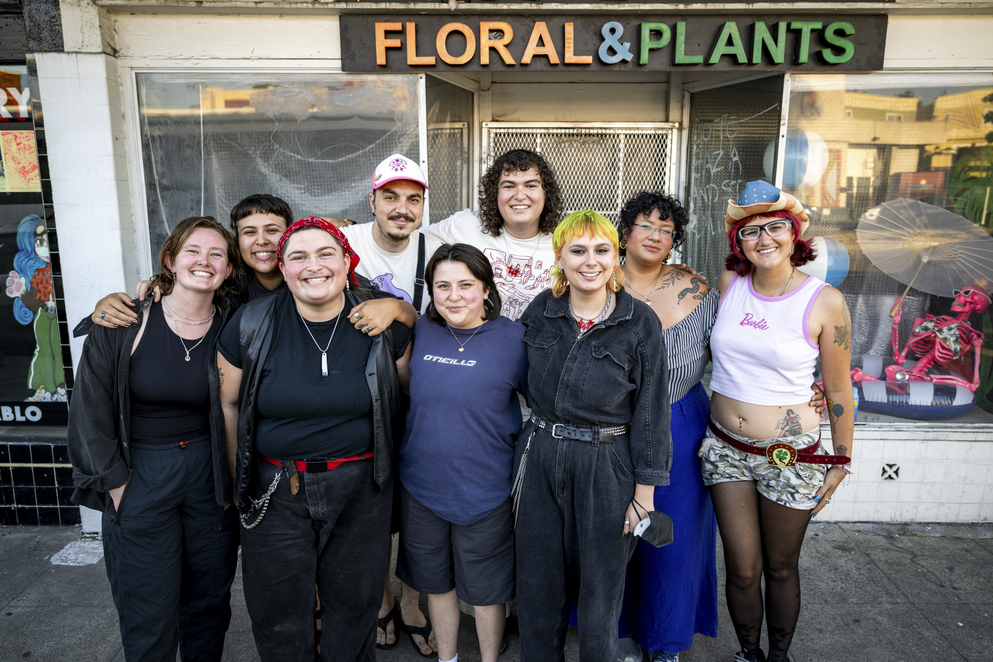 Smiling group of people on sidewalk