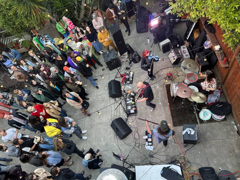 an aerial shot of a backyard rock show