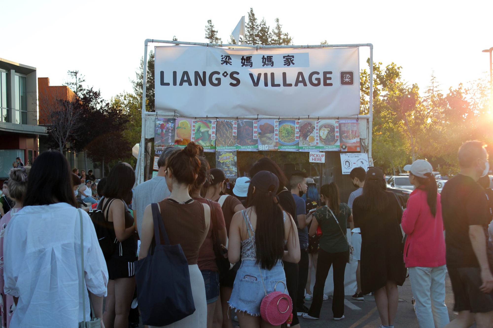 A crowd waits in line at the Liang's Village food stand.