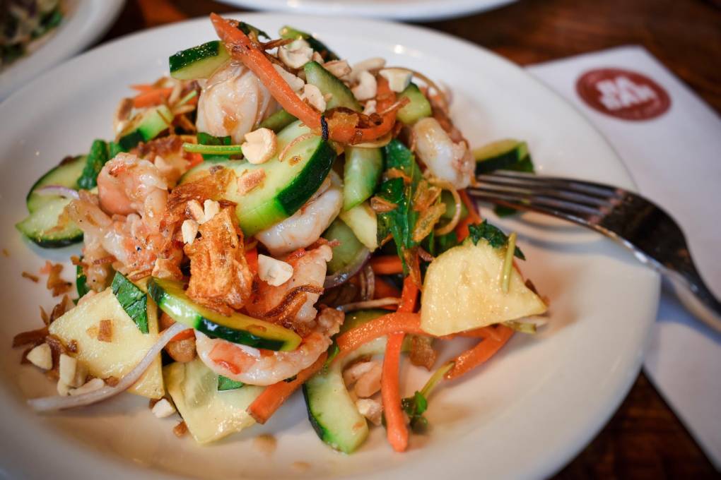 A prawn salad with a wide variety of ingredients.