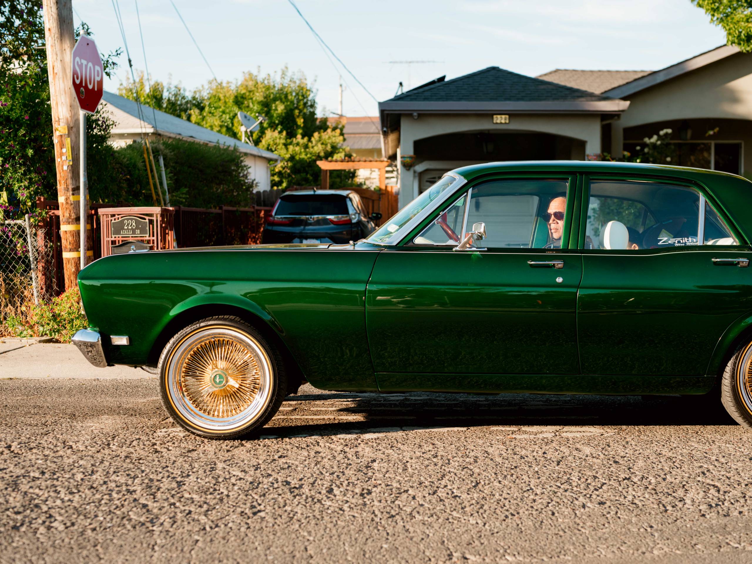 a man in a classic car