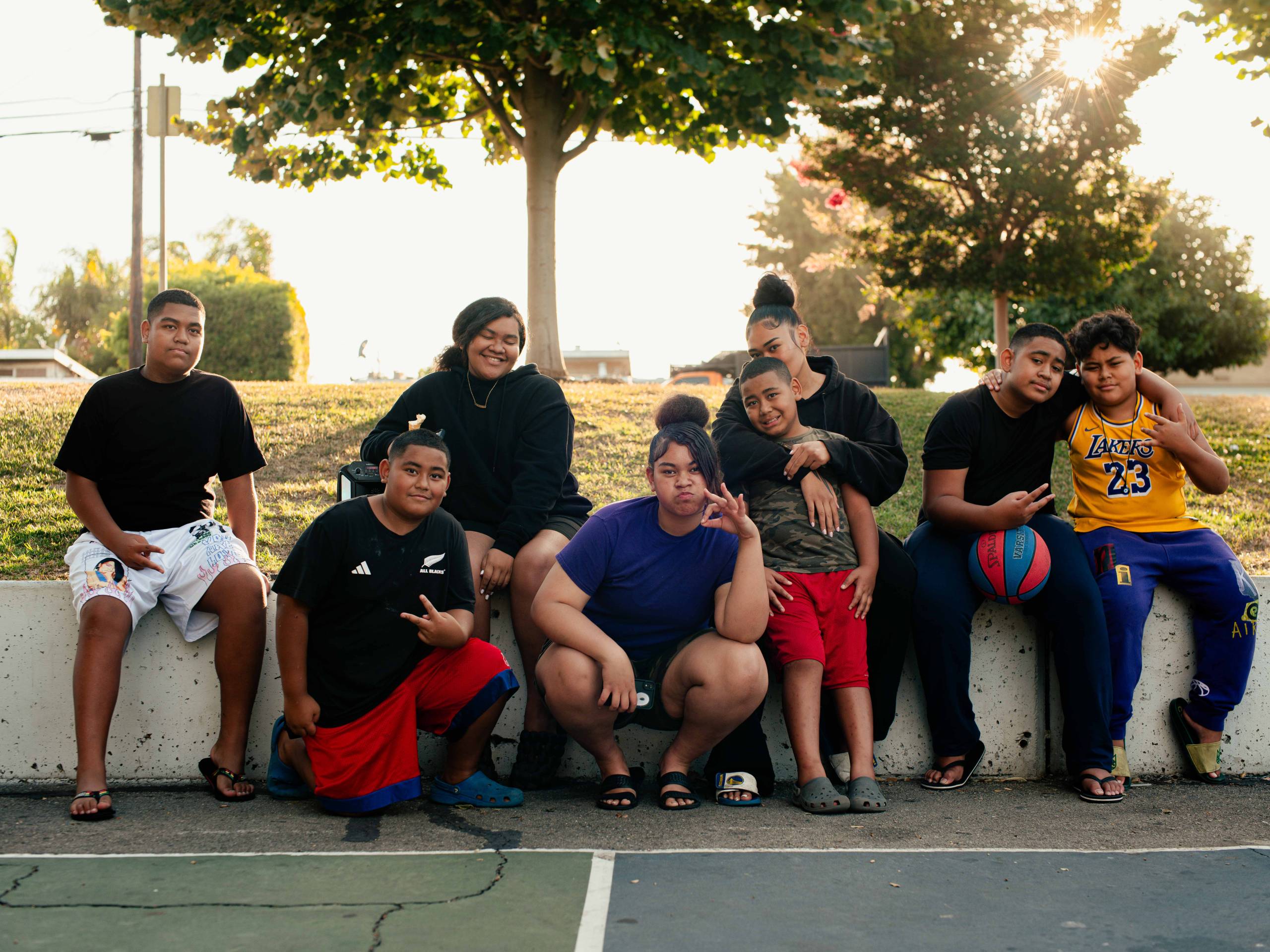 a group of Polynesian family members at a park in East Palo Alto