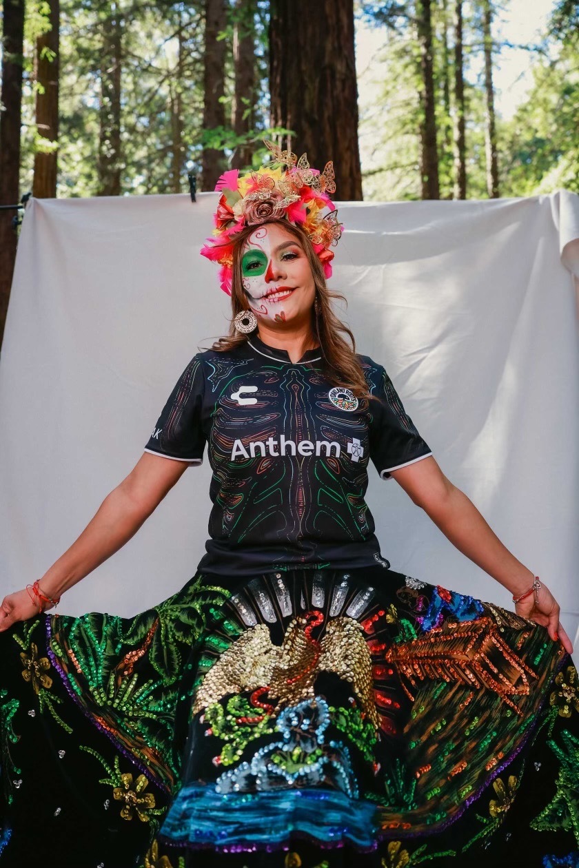 Melissa Castro poses for a photo while wearing the latest Oakland Roots jersey.