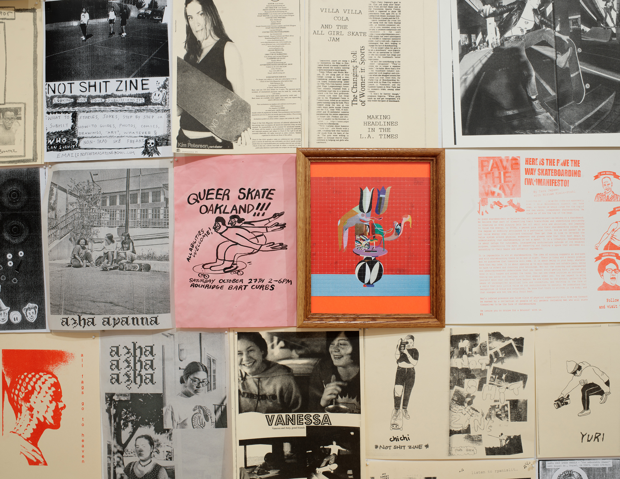 close-up of wall covered in art, zines and flyers