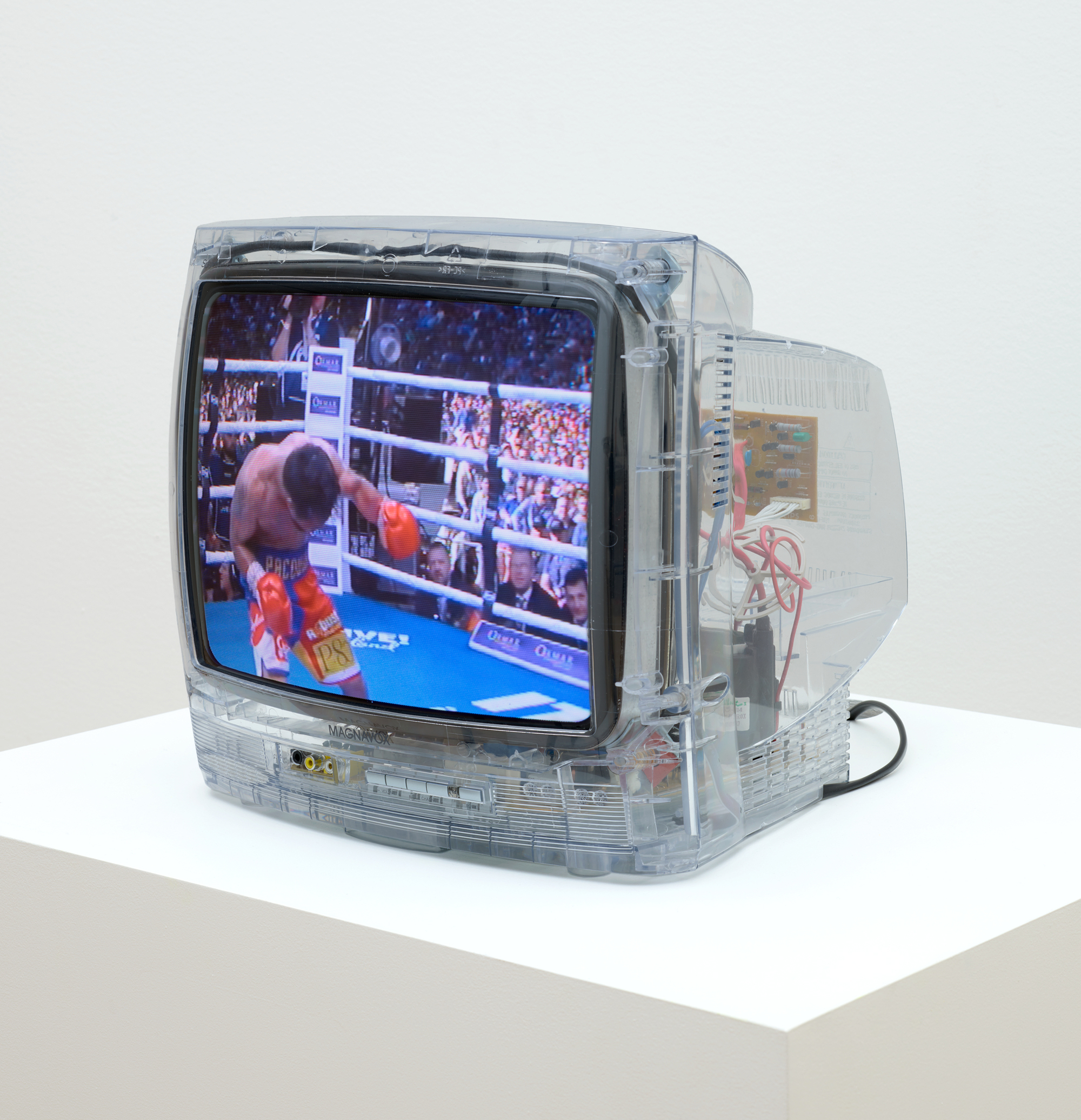 boxing video with missing 2nd boxer on small clear-plastic tv