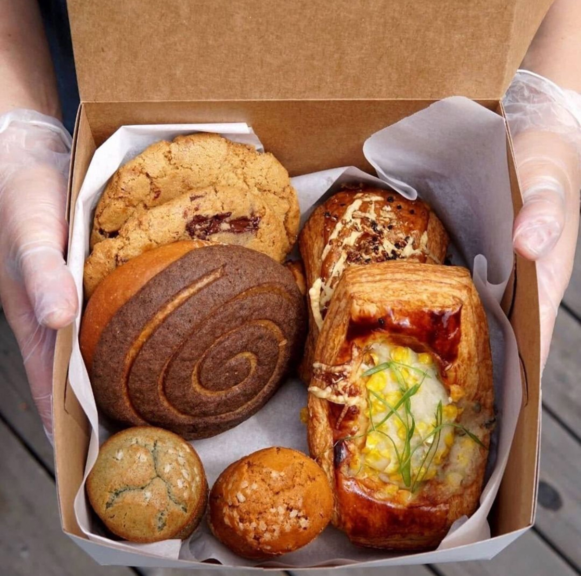 A box of assorted pastries with Asian American flavors.