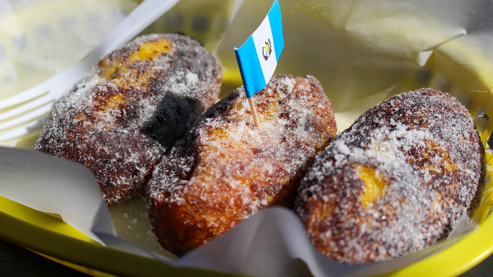 Sugar-coated rellenitos, a fried plantain pastry.