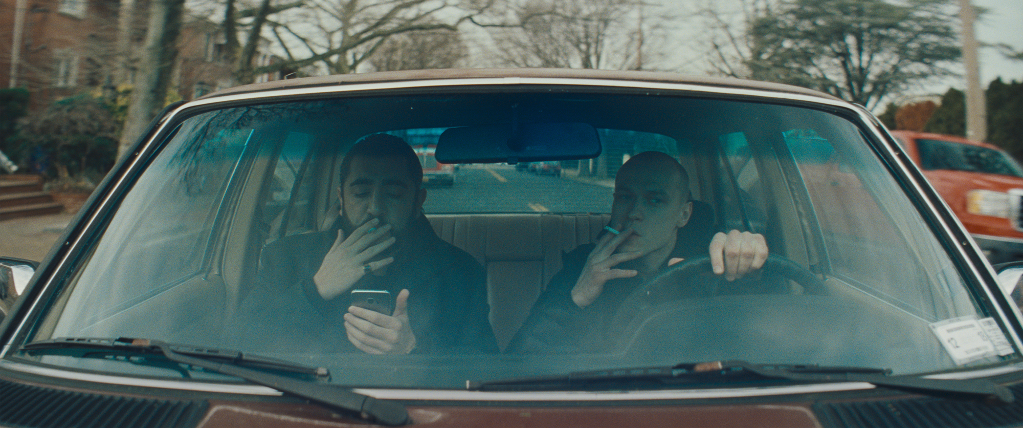 two men in car, smoking