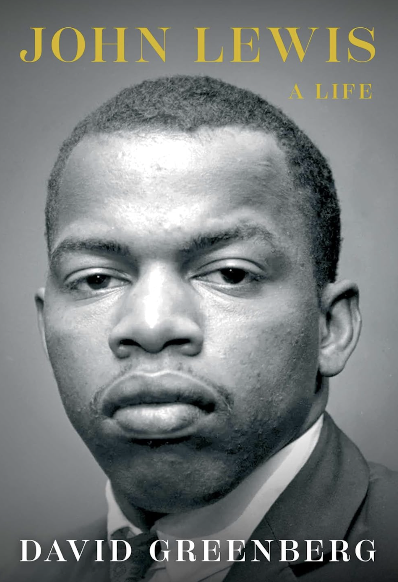 A book cover featuring a black and white portrait photograph of a serious young Black man.